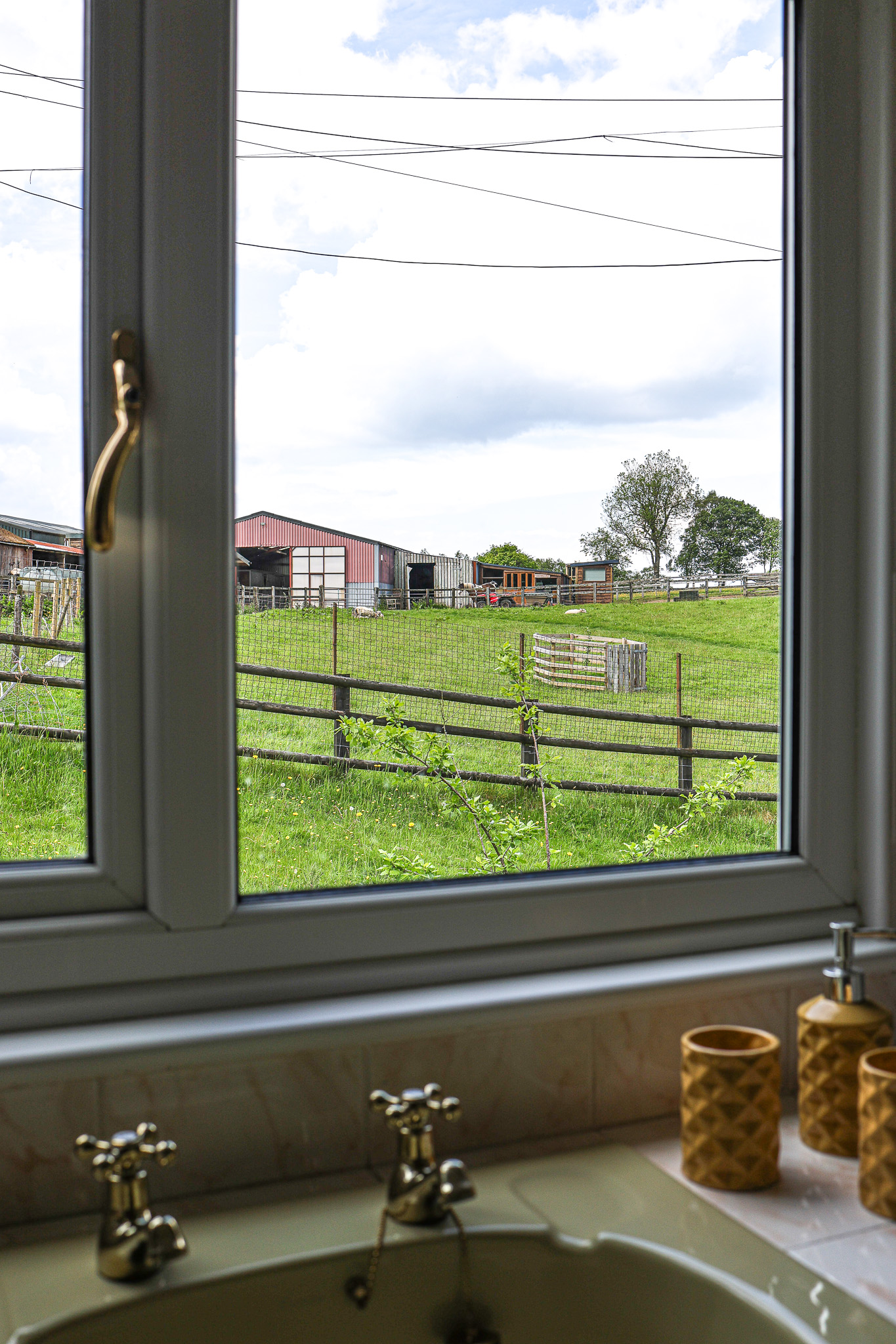 En-suite bathroom with views over the stables